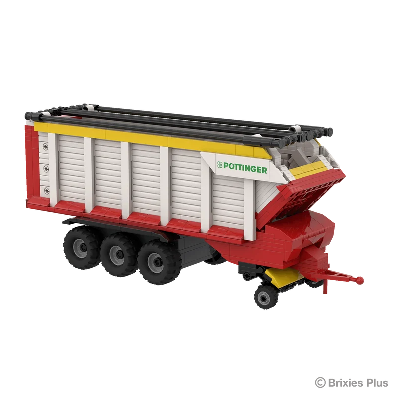 Front angled view of the BRIXIES Plus Pöttinger Jumbo showing the drawbar, pickup section, small support wheel and triple axle chassis
