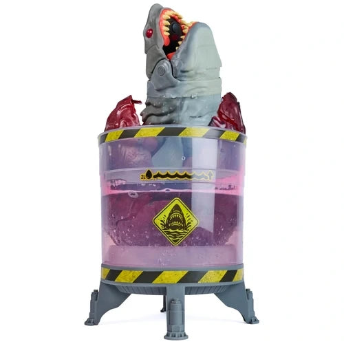 Grey Primal Hatch Megalodon shark emerging upright from a transparent purple hatching tank, with its jaws open, red eye visible and red egg shell pieces surrounding its body.