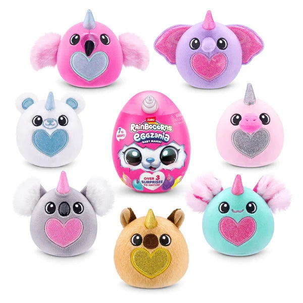 Seven Rainbocorns Eggzania Baby plush characters in assorted colours with glitter hearts arranged around pink Eggzania surprise egg