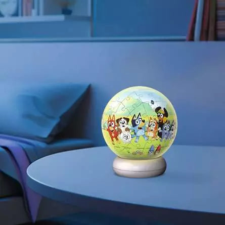 Ravensburger Bluey 3D Puzzle Night Light illuminated on a table in a darkened room