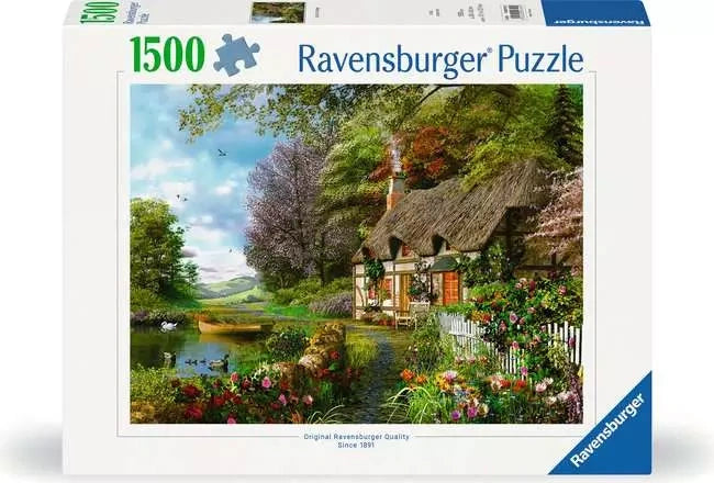 Ravensburger Country Cottage 1500 piece jigsaw puzzle box featuring a thatched cottage beside a pond and colourful garden