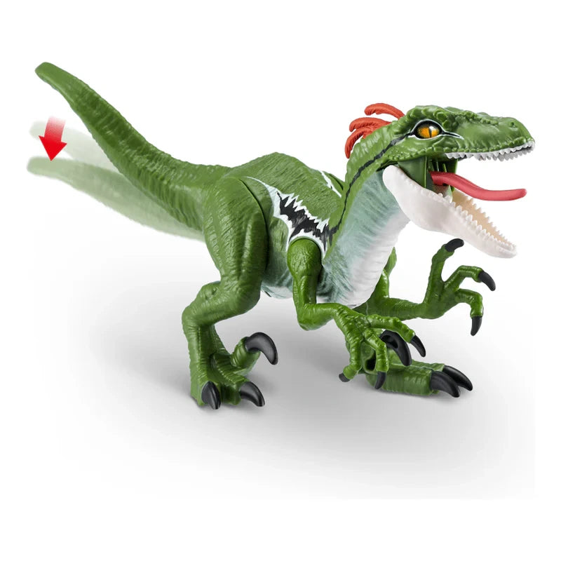 Robo Alive Dino Action Raptor toy figure with open jaw, extended claws and red arrow indicating tail trigger motion
