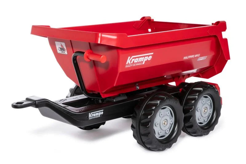 Red Rolly Halfpipe Krampe Trailer with twin axle wheels and a deep round tipped dump bed displayed on a clean white background.