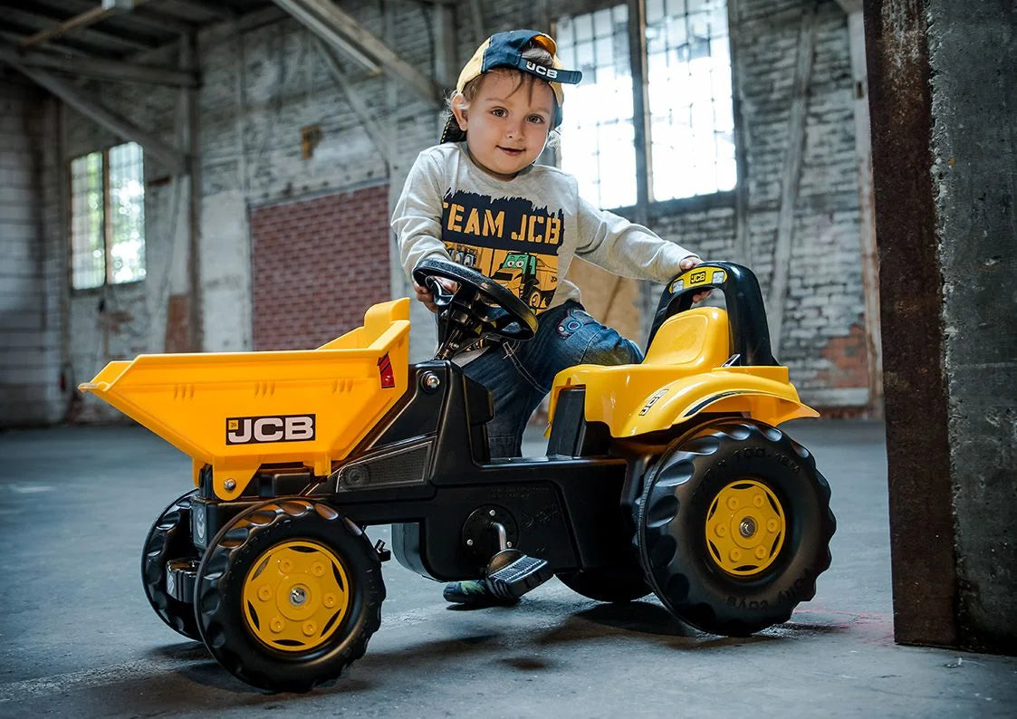 Child riding RollyKid JCB Dumper indoors with steering action – Ireland
