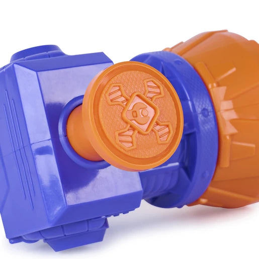 Close view of the orange firing button with a moulded Rubble & Crew paw emblem on the purple Mega Blaster