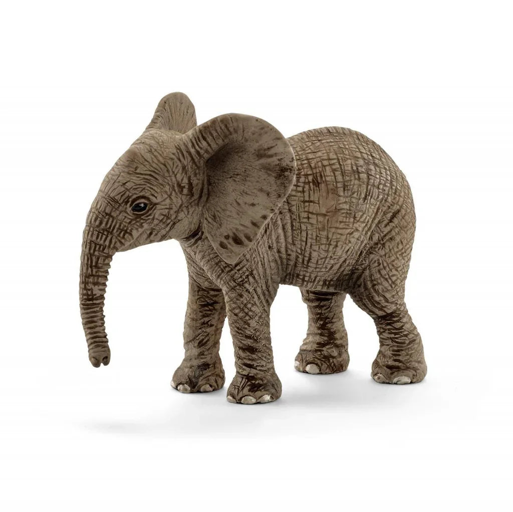 A young elephant figurine with textured grey skin, rounded features, and a slightly lowered trunk.