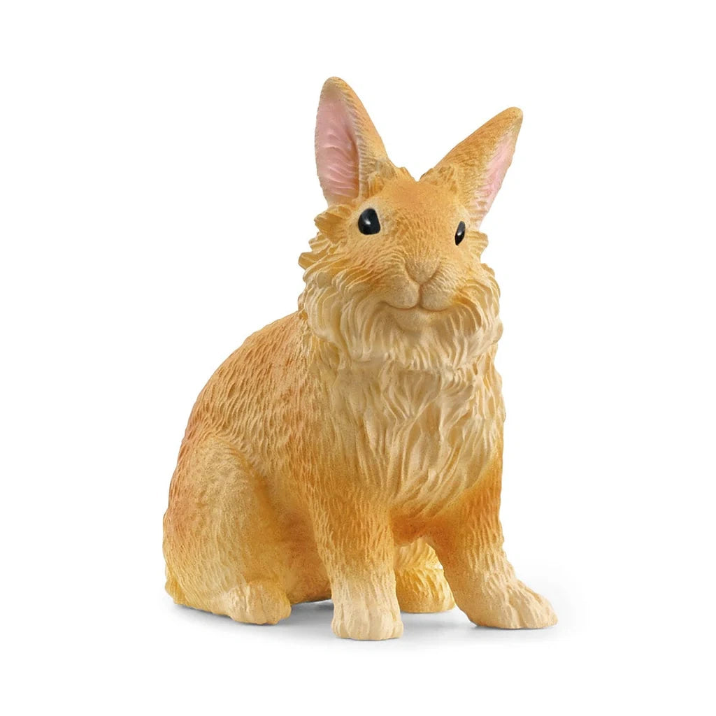 Schleich Lionhead Rabbit figure with a thick mane around its face, a textured golden coat and front paws resting forward