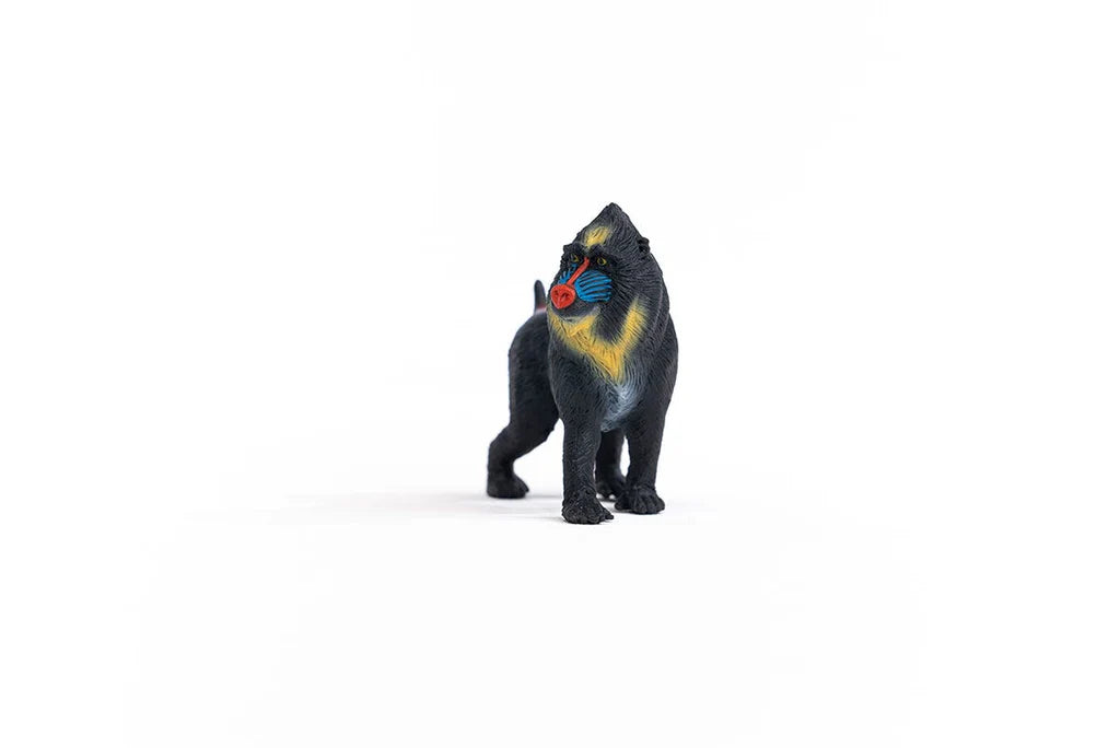 Schleich Mandrill figure standing with yellow chest colouring, a red muzzle and blue facial markings.