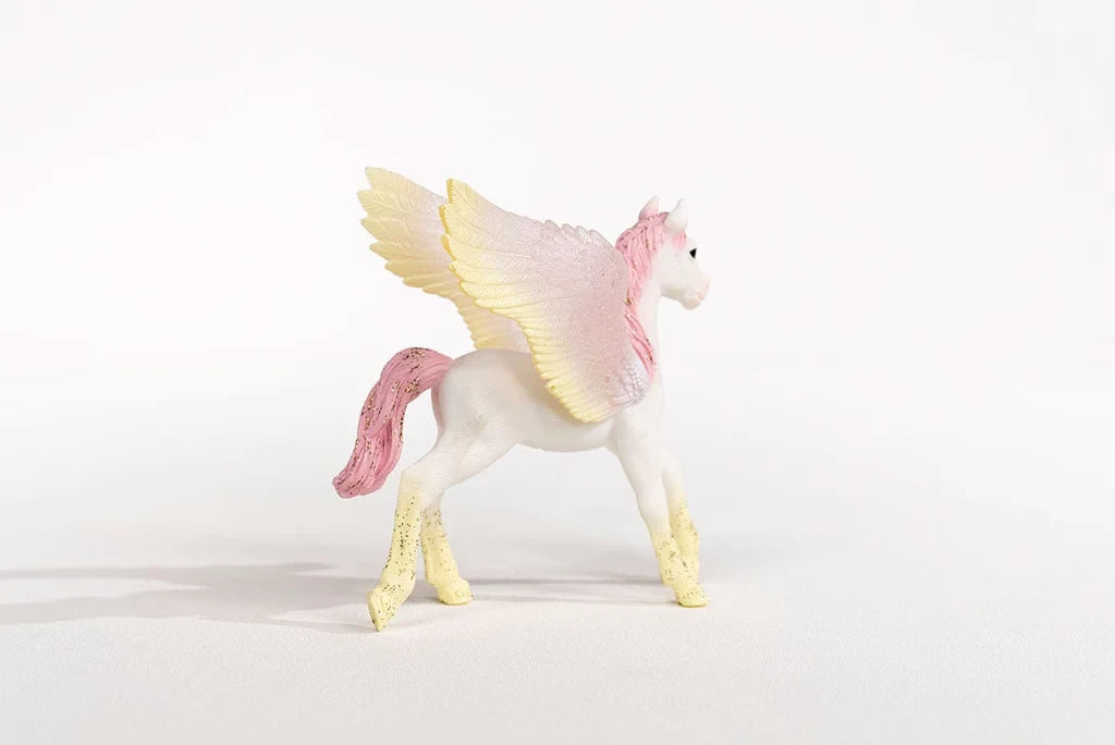 Schleich Sunrise Pegasus Foal figure shown from the rear side with pink tail and yellow wing tips