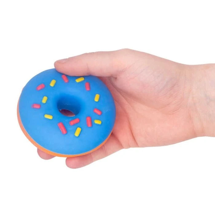 Scrunchems Donut Squishy with blue icing, pink and yellow sprinkles and orange donut held in a hand