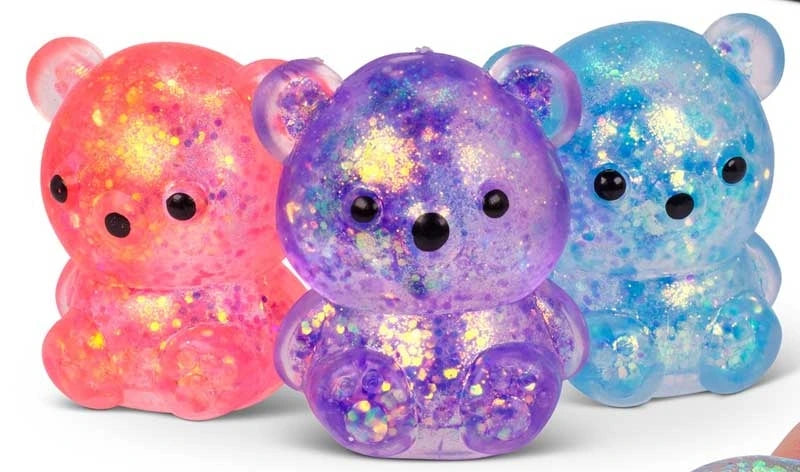 Pink, purple and blue Scrunchems Sugar Bears shown together with translucent bodies, glitter filling and black facial details