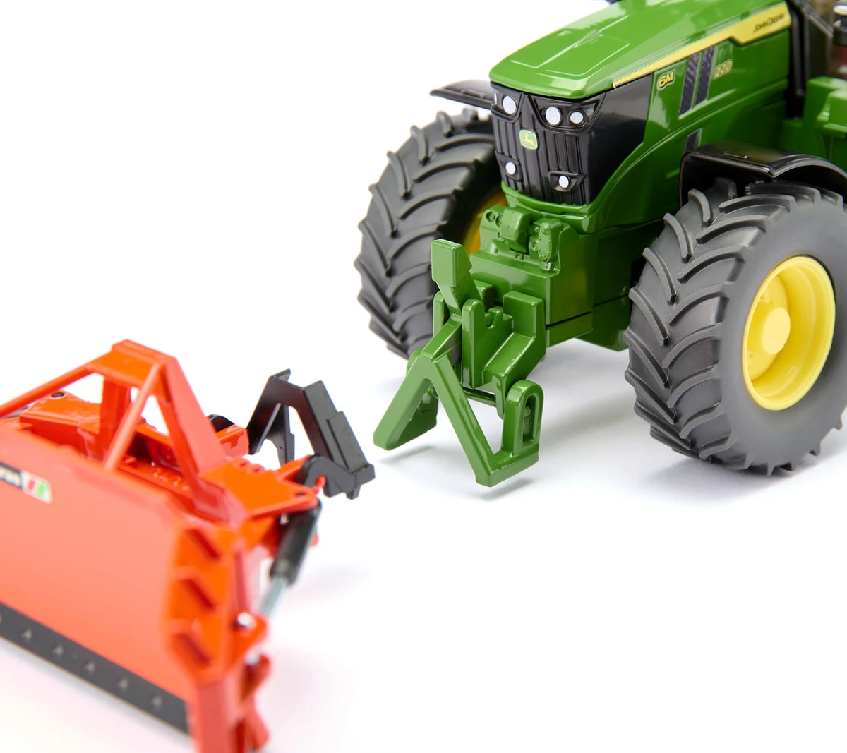 Siku 1:32 John Deere 6M 220 Tractor 3666 front linkage positioned beside a red Siku implement