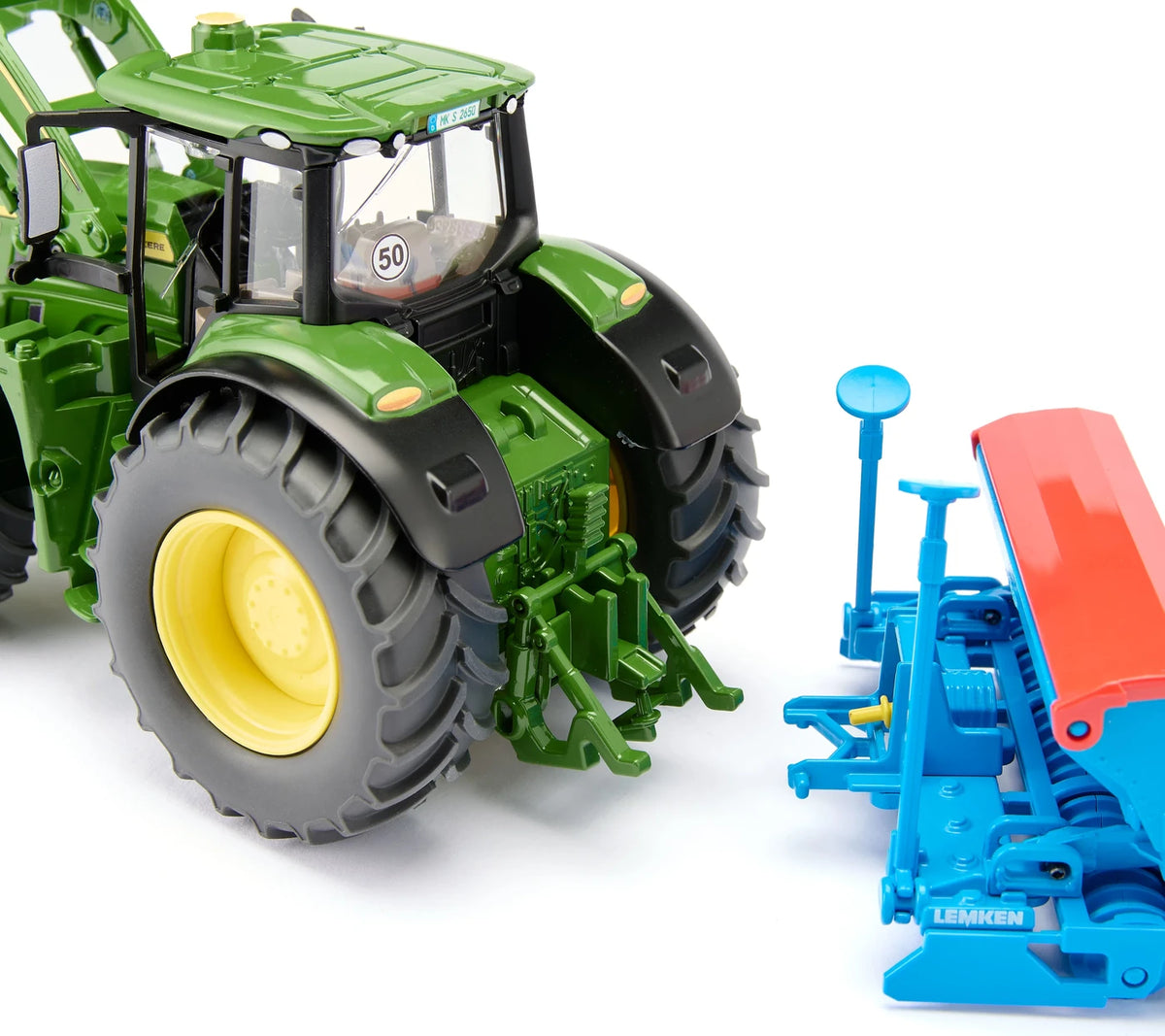 Siku 1:32 John Deere 6M 220 Tractor 3666 rear view showing the rear linkage beside a blue Siku implement