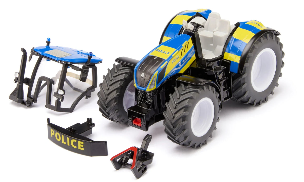 Siku New Holland Police Tractor 3297 shown with the removable cab, Police front weight and front coupling parts separated from the tractor