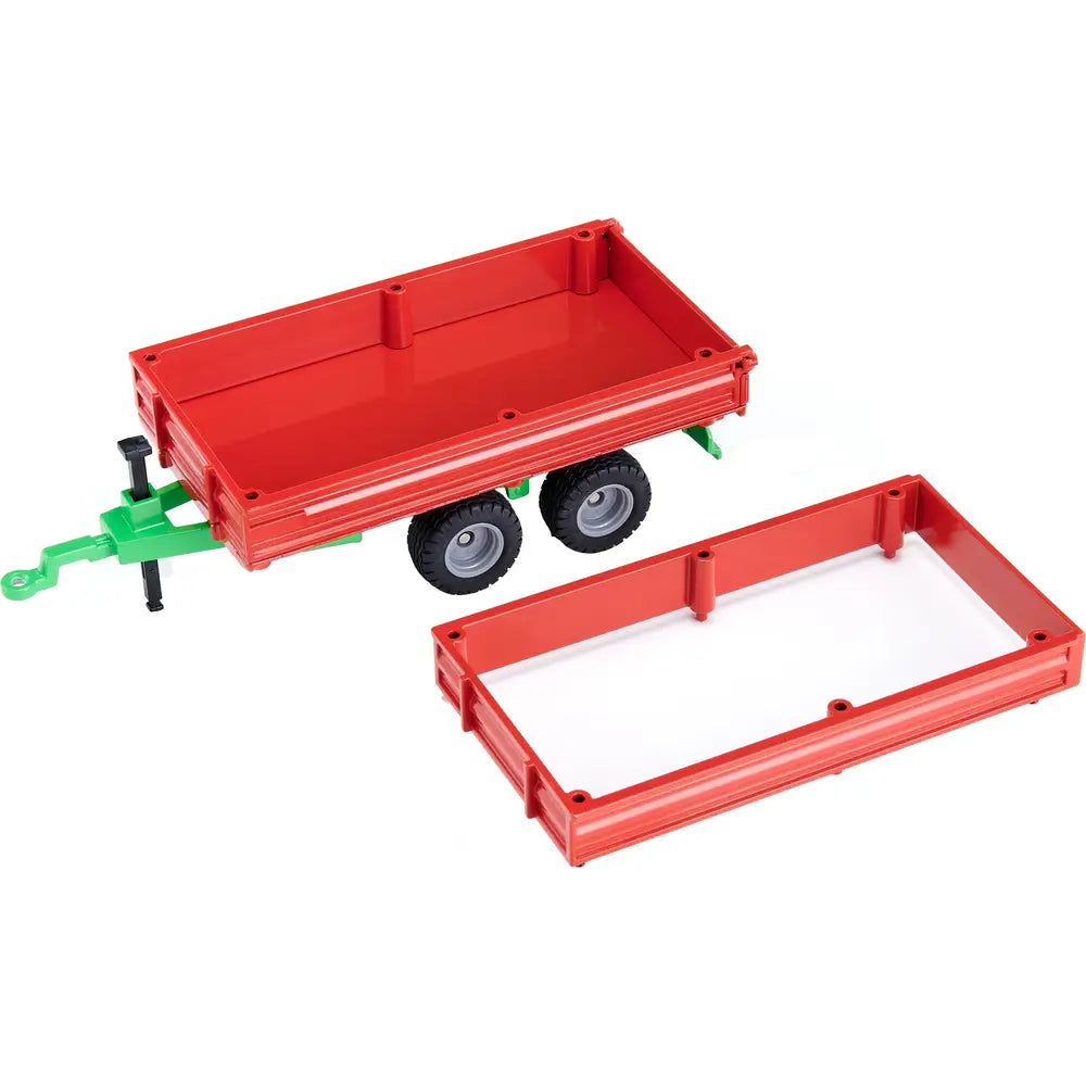 Siku tandem axle trailer with red bed panels removed and placed beside the trailer, showing open trailer base and twin axle wheels
