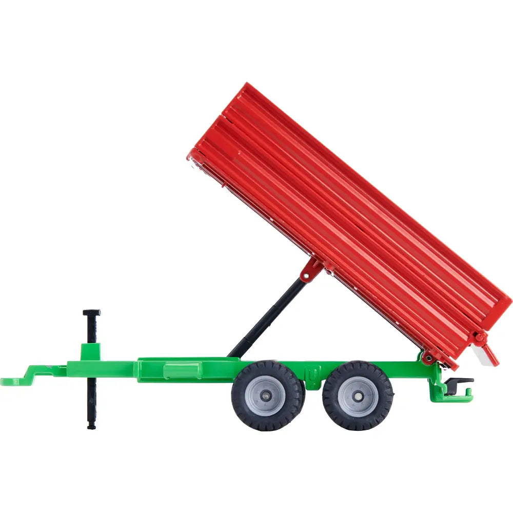 Siku tandem axle trailer with tipping bed raised showing red trailer body angled upward on green chassis with twin axle wheels