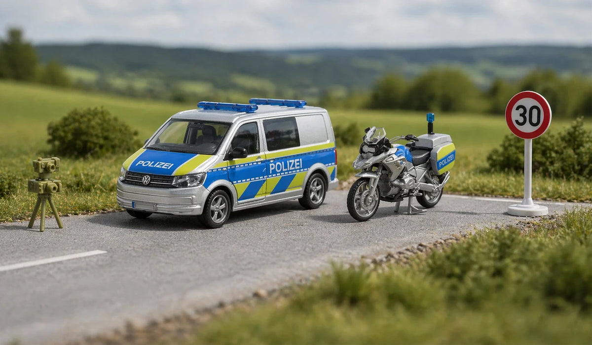 Siku VW T6 police van and BMW police motorbike 2562 displayed in a roadside scene with speed camera and 30 km/h sign