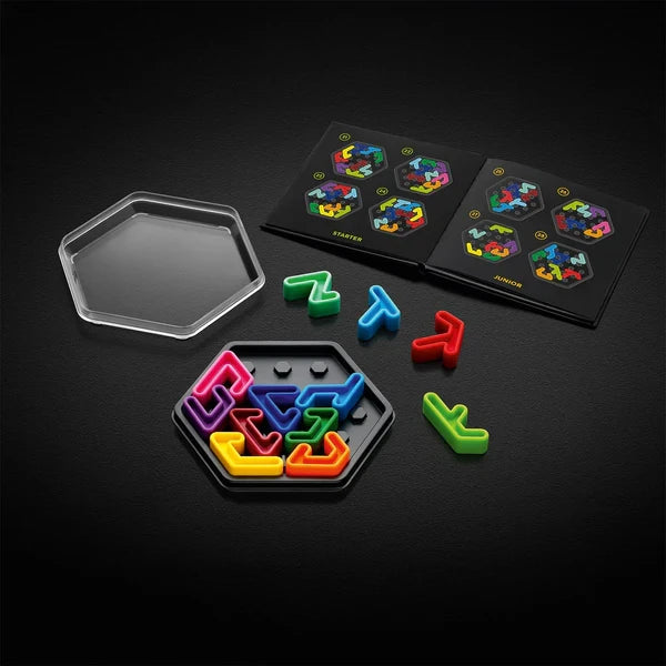 SmartGames IQ Hexagon game board with clear lid, loose colourful pieces and black challenge pages