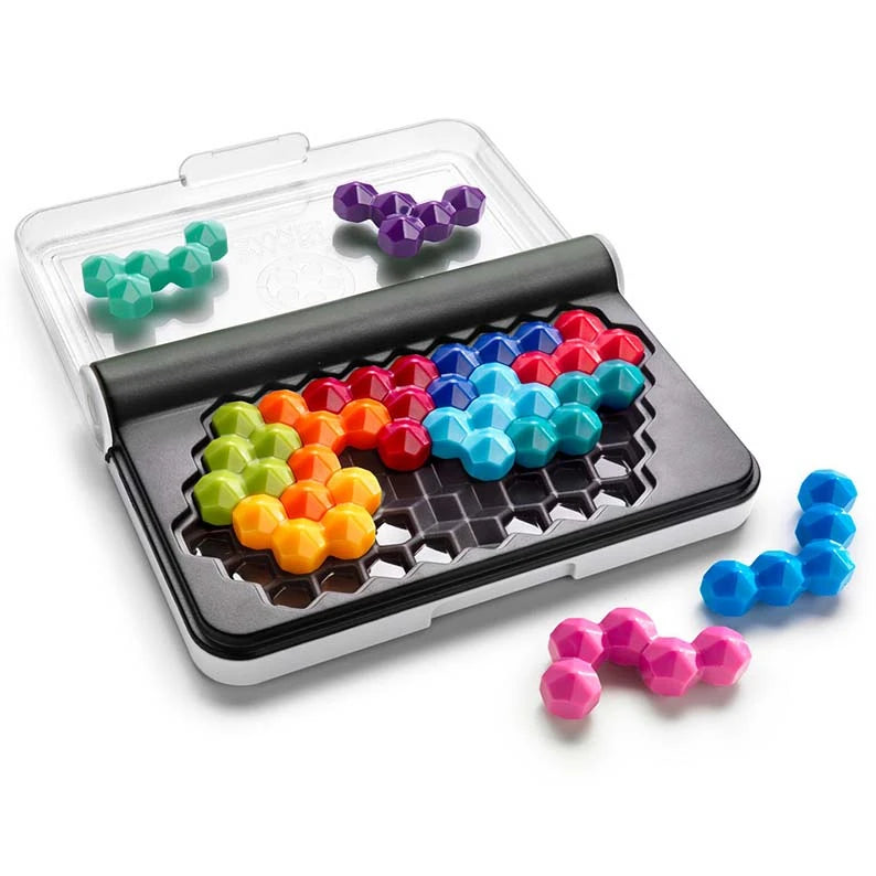 Open black puzzle case with clear lid, colourful pieces fitted in the grid and loose blue and pink pieces beside it