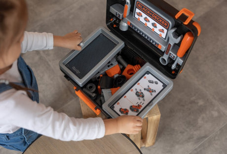 Child playing with Smoby Black+Decker Bricolo Box DIY set – Ireland