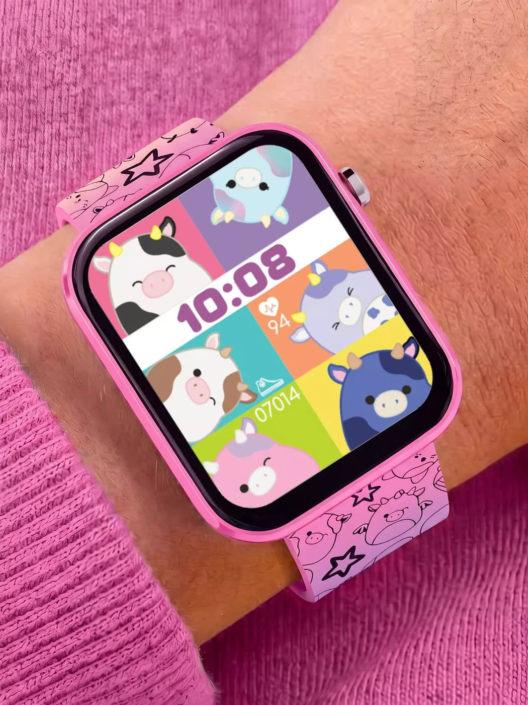 Squishmallows Rainbow Strap Smart Watch worn on the wrist with colourful Squishmallows watch face and pink printed strap