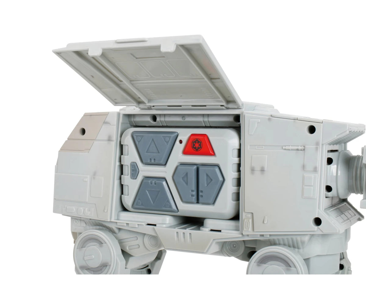 Close-up of the Star Wars RC Walking AT-AT with its upper body hatch open, revealing the grey remote controller stored inside.
