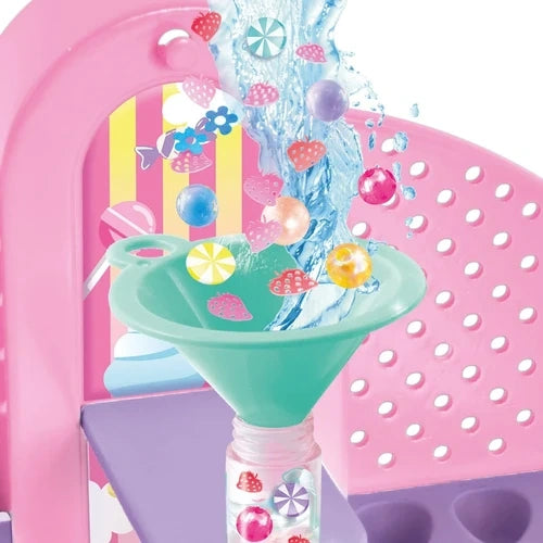 Green funnel above a clear pen barrel with colourful pieces and water splash graphics