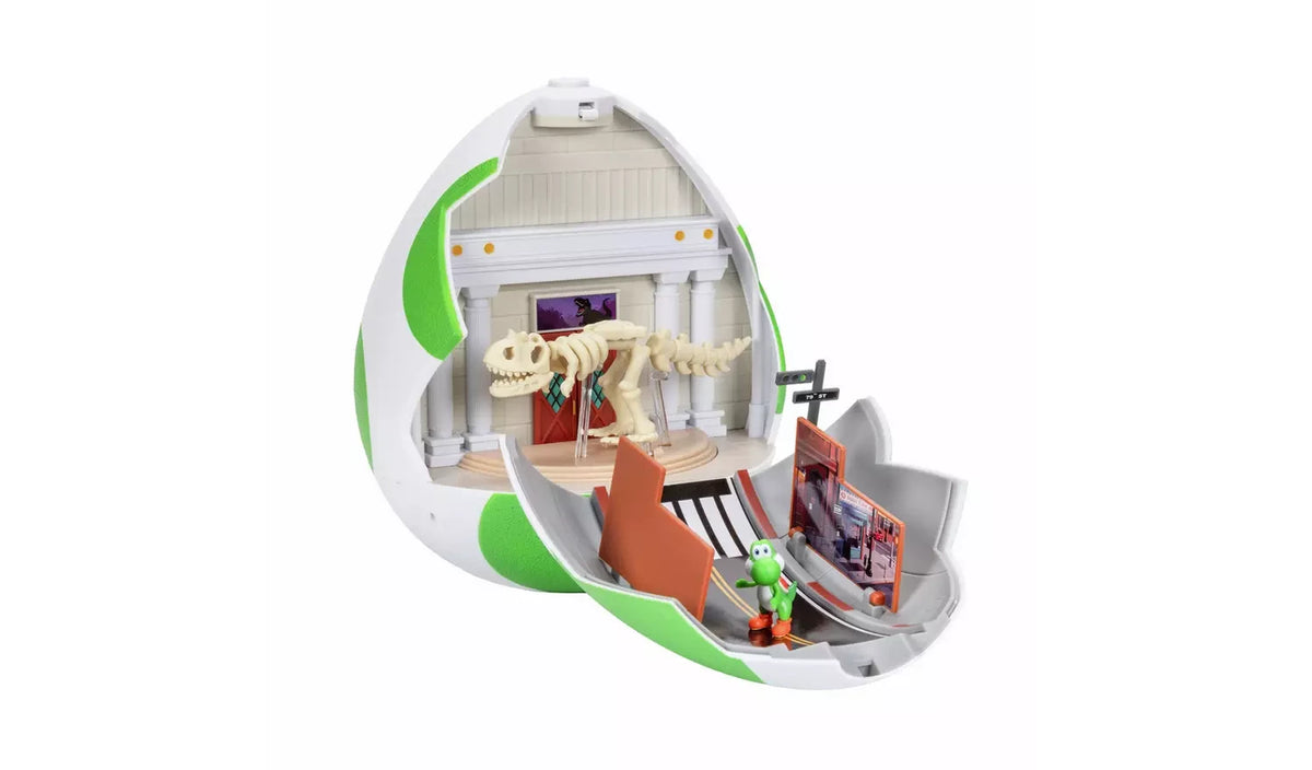 Museum interior of the Yoshi Egg Playset showing Yoshi beside a cream dinosaur skeleton lying across the display floor, with a hand touching one of the bone pieces.