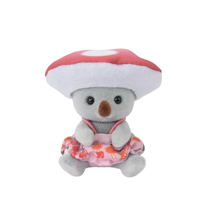 Sylvanian Families character wearing a mushroom costume with a broad red cap, displayed against a white background.