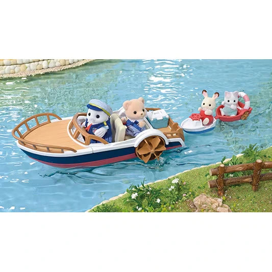 Sylvanian Families leisure boat with a white seal and beige animal figure aboard, towing a white boat with a rabbit and a red boat with a grey cat on blue water.