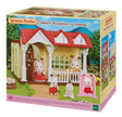 Box packaging of Sylvanian Families Sweet Raspberry Home set with red roof and Chocolate Rabbit Baby figure in Ireland.