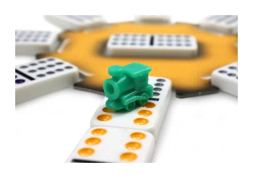 Closeup of green train pawn on domino track from Mexican Train game Ireland