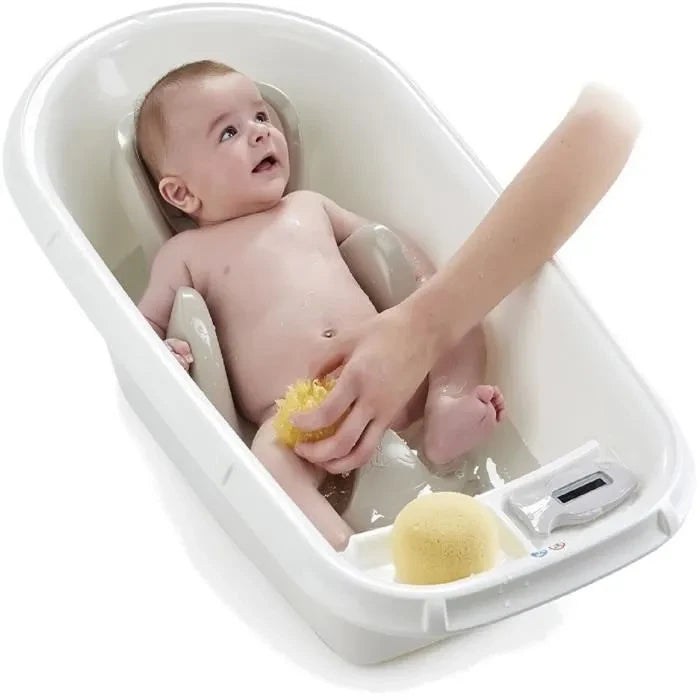 Thermobaby Babycoon Grey Charm Bath Seat shown in use inside a white baby bath