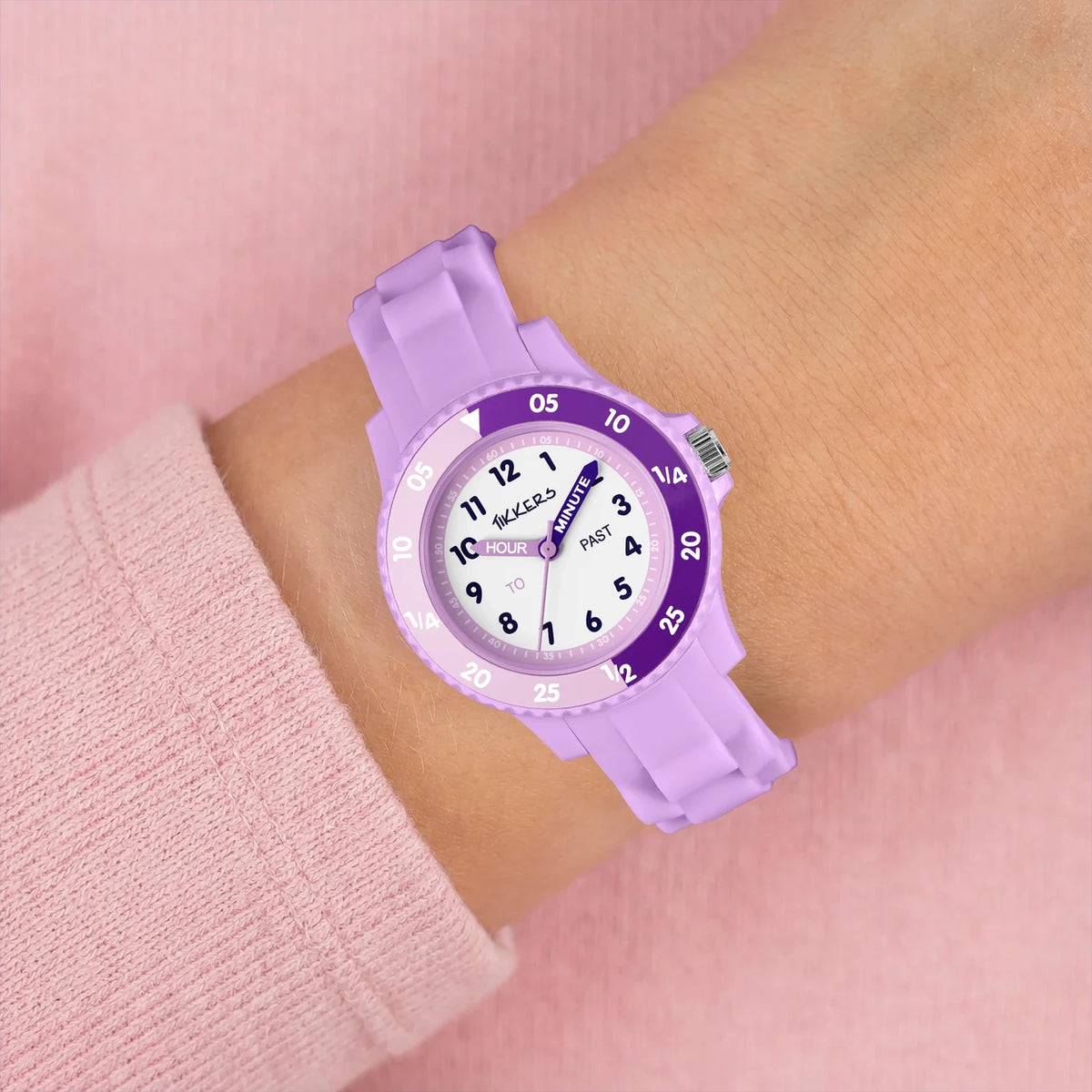 Tikkers Lilac Silicone Time Teacher Watch worn on the wrist with lilac silicone strap and purple time teacher dial