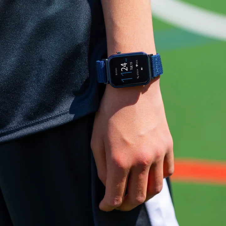 Tikkers Series 13 Navy Riptape Smart Watch worn on the wrist with navy fabric strap and colour touchscreen display