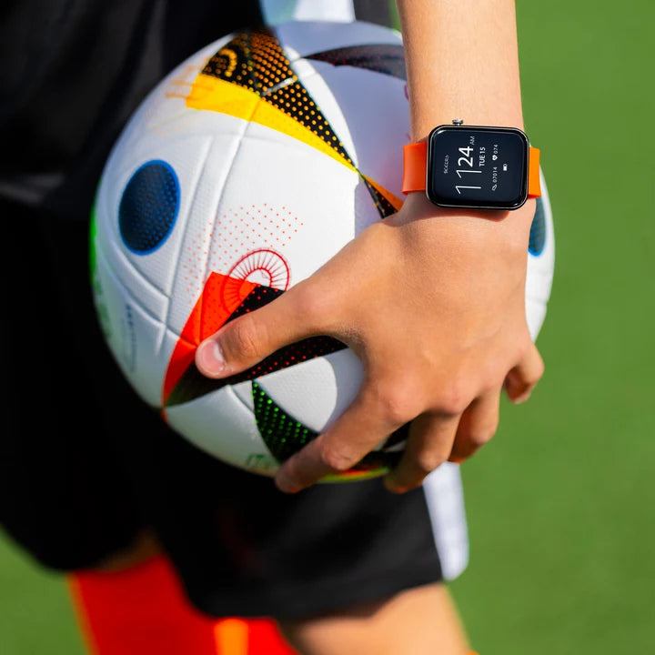 Tikkers Series 13 Orange Silicone Smart Watch worn on the wrist with orange strap and digital display
