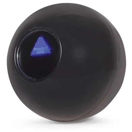 Close-up of Mystic 8 Ball answer window showing blue triangle message – Ireland