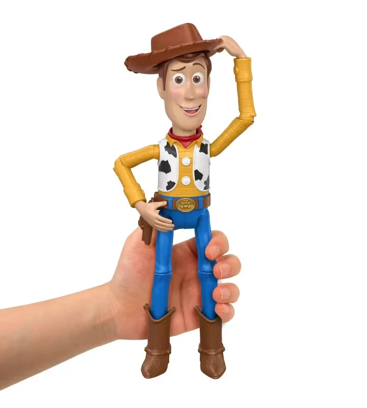 Hand holding Woody figure from the front with one hand touching his hat