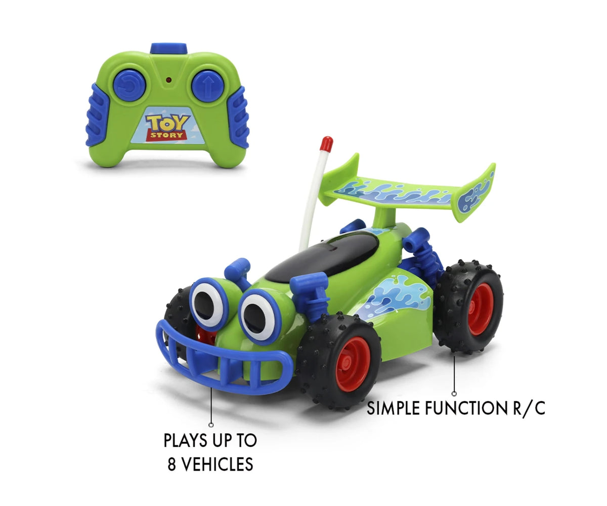 Toy Story RC Turbo Buggy feature graphic showing the green and blue two button controller beside the buggy, with large cartoon eyes and knobbly black tyres.