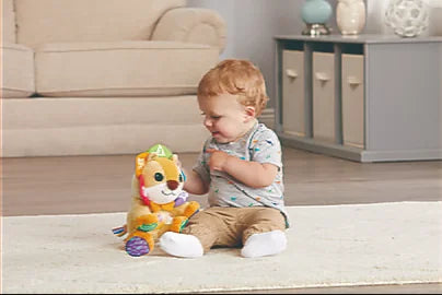 Toddler playing with VTech Lullaby Lights Lion plush learning toy – Ireland