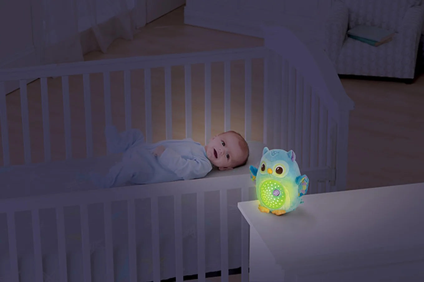 Baby with VTech Twinkle Lights Owl soft toy glowing in room – Ireland