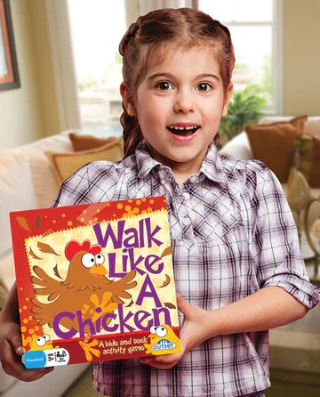Young child holding Walk Like A Chicken game box smiling indoors in Ireland