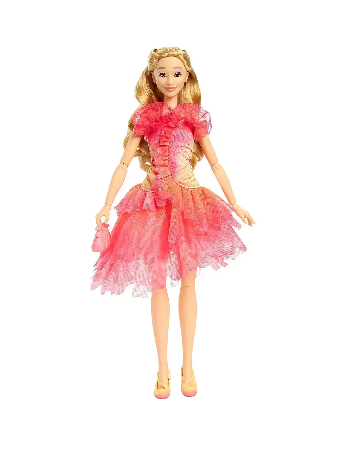 Glinda doll standing in her pink layered dress with long blonde hair styled and her matching pink handbag held at her side