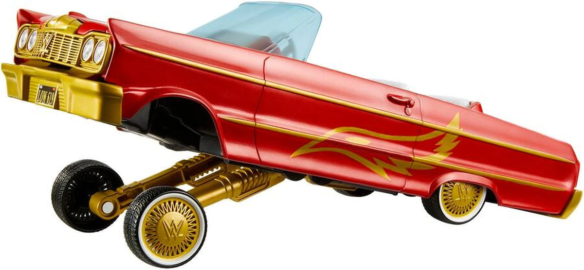 WWE Lucha Low Rider Vehicle side view with raised suspension, red body, gold graphics and white interior