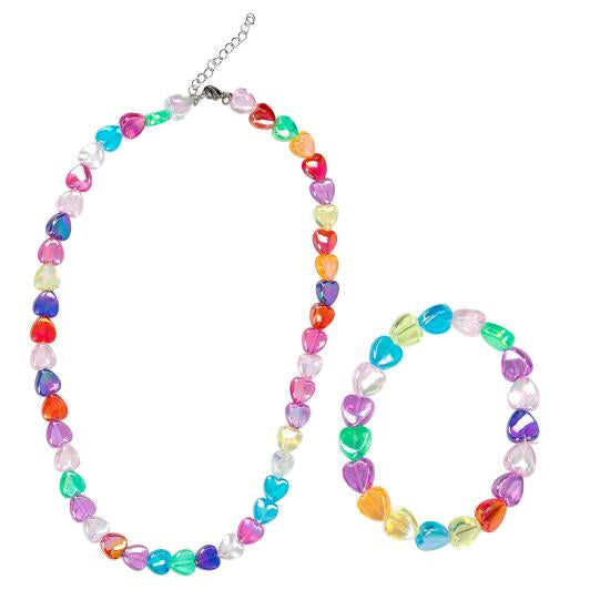 Ylvi necklace and bracelet arranged together, made from colourful heart shaped beads with a silver coloured clasp and extension chain.