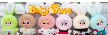 Cute Baby Three plush toys with large bunny ears in pastel colours, displayed in a row in Ireland.