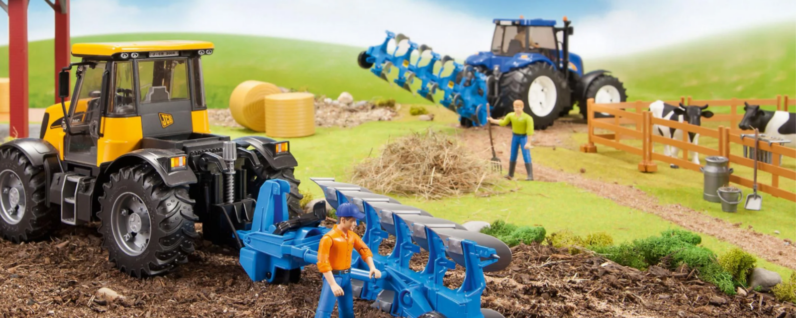 Farm toy setting with two tractors ploughing a field and farmer figures and cows visible
