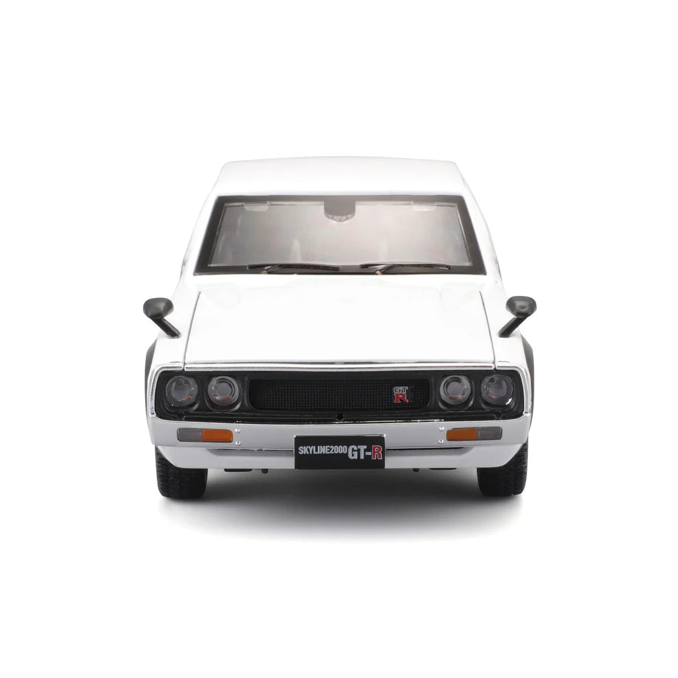 Front view of the white 1:24 Nissan Skyline 2000GT-R model with round headlights, black grille, GT-R badge and Skyline 2000 GT-R front plate