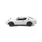 Left side view of the white 1:24 Nissan Skyline 2000GT-R model with black wheels, side mirrors, rear spoiler and Skyline GT-R side badge