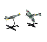 Two assembled 1:72 scale aircraft models showing a Supermarine Spitfire Mk.Vc and a Messerschmitt Bf109F-4 mounted on display stands against a white background facing left.
